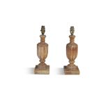 A PAIR OF ALBASTER FLUTED LAMPS, of baluster form, raised on square platform bases. 37cm high to