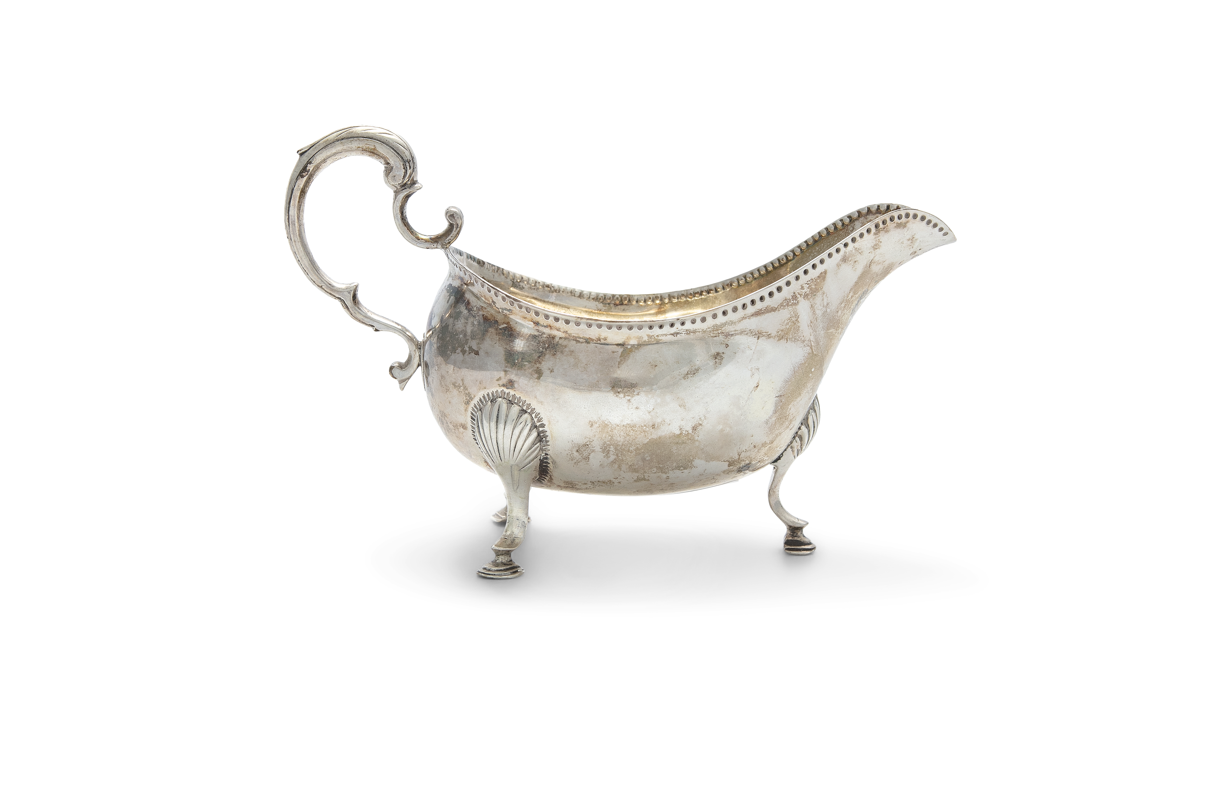 A GEORGE III IRISH SILVER SAUCE BOAT, Dublin c.1775, mark of Matthew West, the plain body with