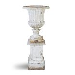 A VICTORIAN WHITE PAINTED CAST IRON GARDEN URN, of classical design with everted rim and fluted
