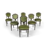 A SET OF SIX VICTORIAN EBON FRAME SIDE CHAIRS, with shield backs, on turned tapering fluted legs,