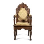 AN IRISH OAK FRAMED HALL SEAT, 19th century with arched upholstered back, carved leafy crest and