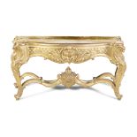 A FRENCH CARVED GILT WOOD SIDE TABLE IN LOUIS VI STYLE, of serpentine form, with detachable fabric