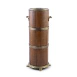 AN OAK AND BRASS BOUND CYLINDRICAL STICK STAND, late 19th century, fitted with twin handles, brass