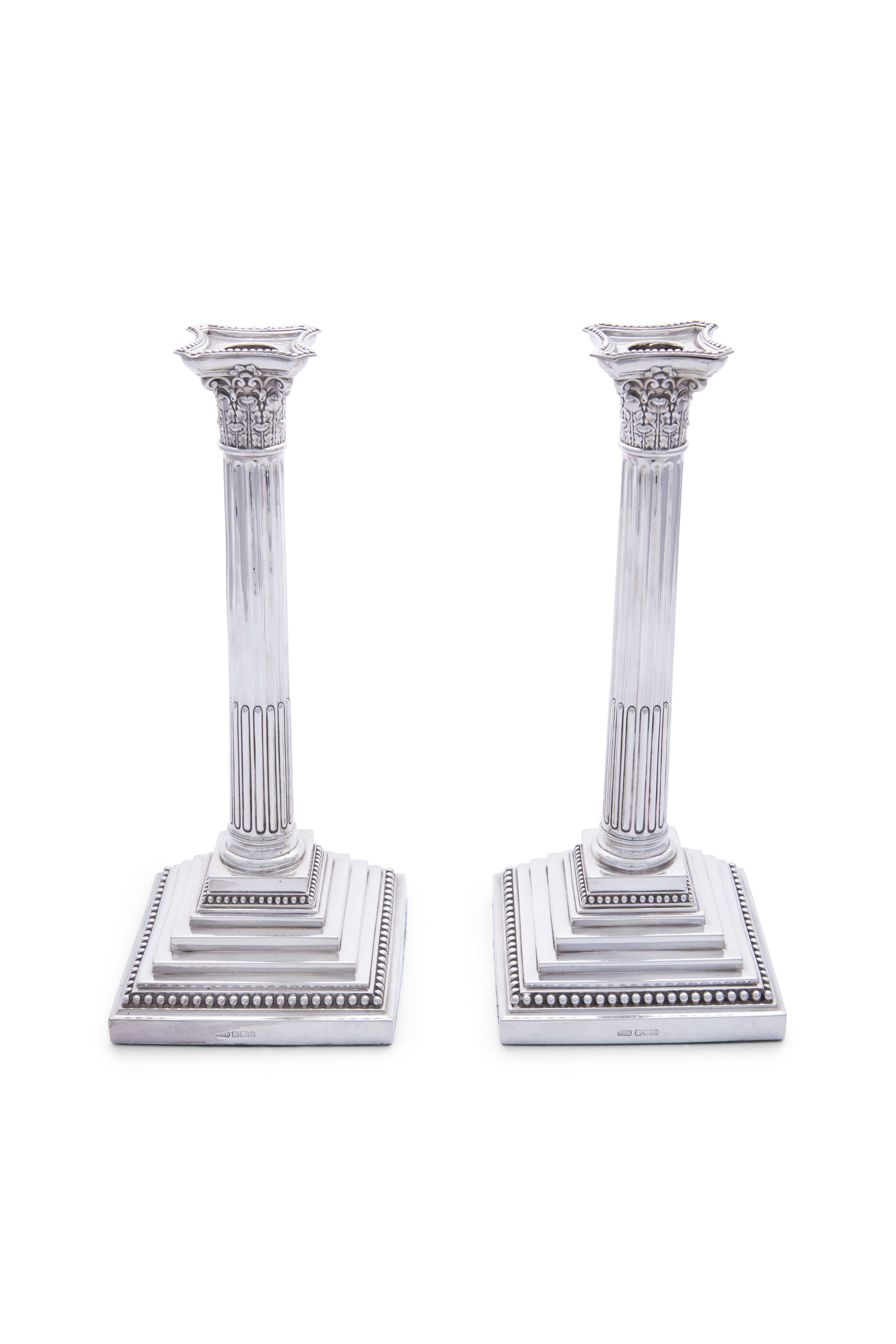 A PAIR OF SILVER CANDLESTICKS IN THE FORM OF CORINTHIAN COLUMNS, Sheffield c.1911, mark of