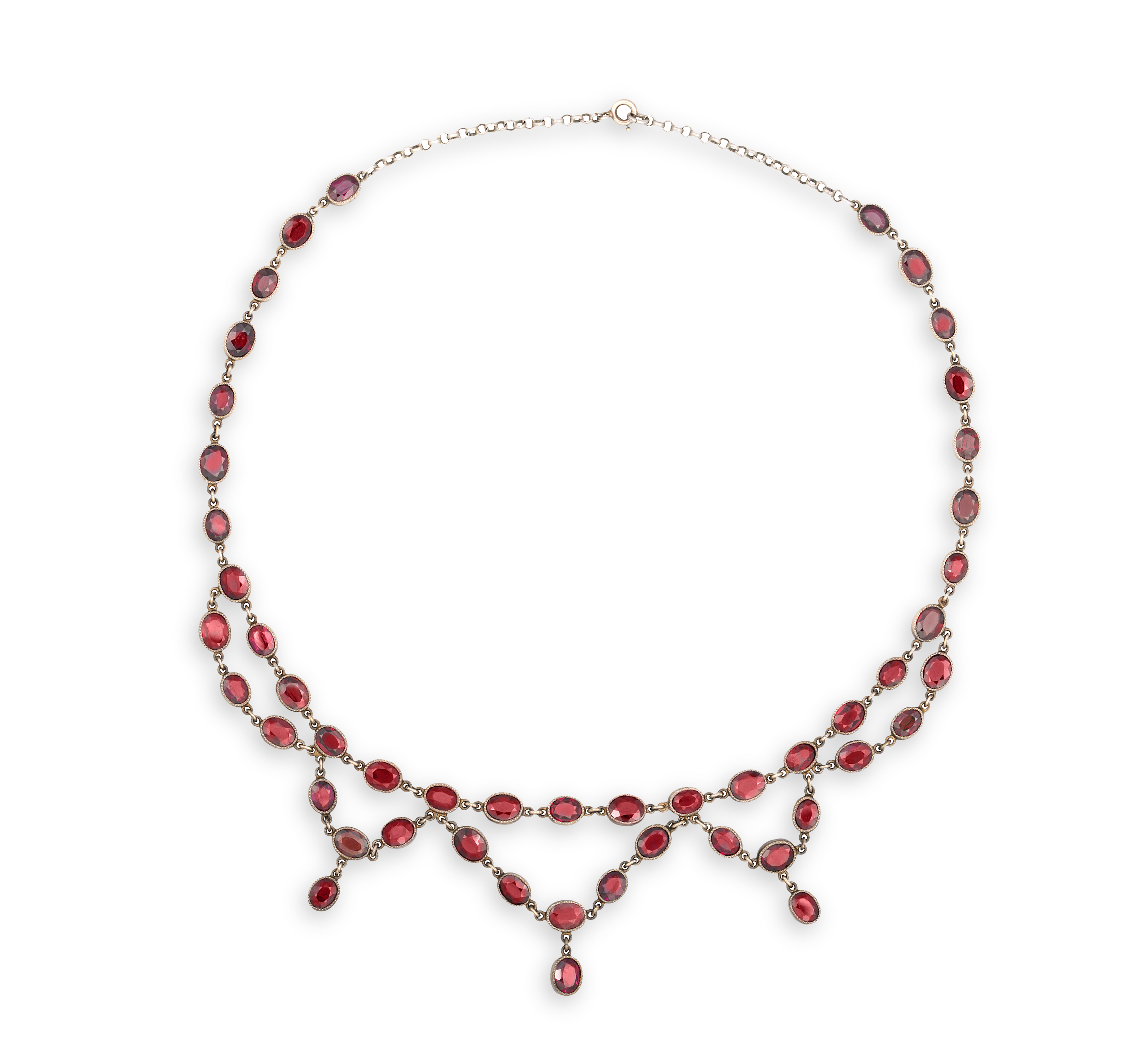 A SILVER AND GARNET NECKLACE, composed of oval-shaped garnets within collet and millegrain