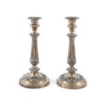A PAIR OF OLD SHEFFIELD PLATED TABLE CANDLESTICKS, early 19th century, finely cast with foliate