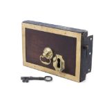 A GEORGIAN MAHOGANY AND BRASS MOUNTED DOOR LOCK, of rectangular shape with brass bracket handle,