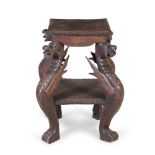 A 19TH CENTURY CARVED WOOD SQUARE TOP STAND, raised on carved dragon supports with undertier. 101.