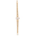 AN 18CT GOLD LADY'S WATCH, the round convex face with baton numerals with milled winder and