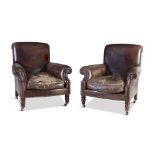 A PAIR OF VICTORIAN LEATHER UPHOLSTERED ARMCHAIRS, with padded rectangular backs and out scrolling