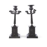 A PAIR OF FRENCH BRONZE DESK CANDLE STICKS, each with nine scroll arms, above tapering column and