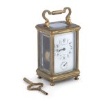 A SMALL TIFFANY & CO. BRASS CASED CARRIAGE CLOCK, surmounted by a swing handle, with glass panel