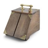 A WALNUT AND BRASS MOUNTED SLOPE FRONT COAL SCUTTLE, 19th century, fitted with shovel and mounted