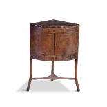 A GEORGE IV INLAID MAHOGANY CORNER WASH STAND, with folding top opening to reveal bowl and tumbler