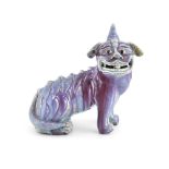 A DECORATIVE CHINESE GLAZED FO-DOG, modelled in seated position, 27cm high