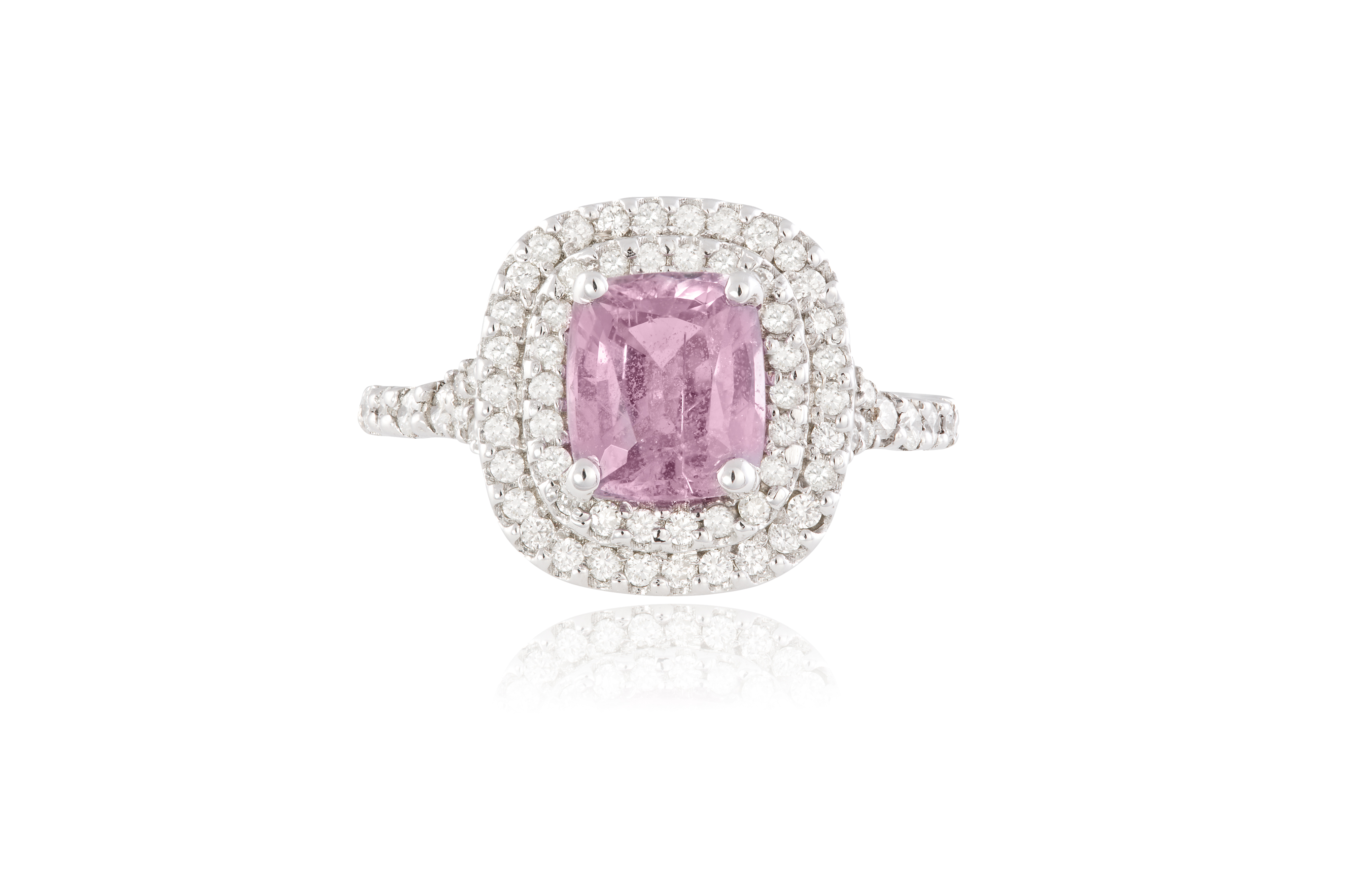 A PINK SAPPHIRE AND DIAMOND CLUSTER RING, the cushion-shaped pink sapphire within a surround of