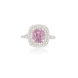 A PINK SAPPHIRE AND DIAMOND CLUSTER RING, the cushion-shaped pink sapphire within a surround of