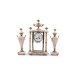 A FRENCH THREE PIECE CLOCK GARNITURE, comprising a mantle clock and twin side urns, each with shaped