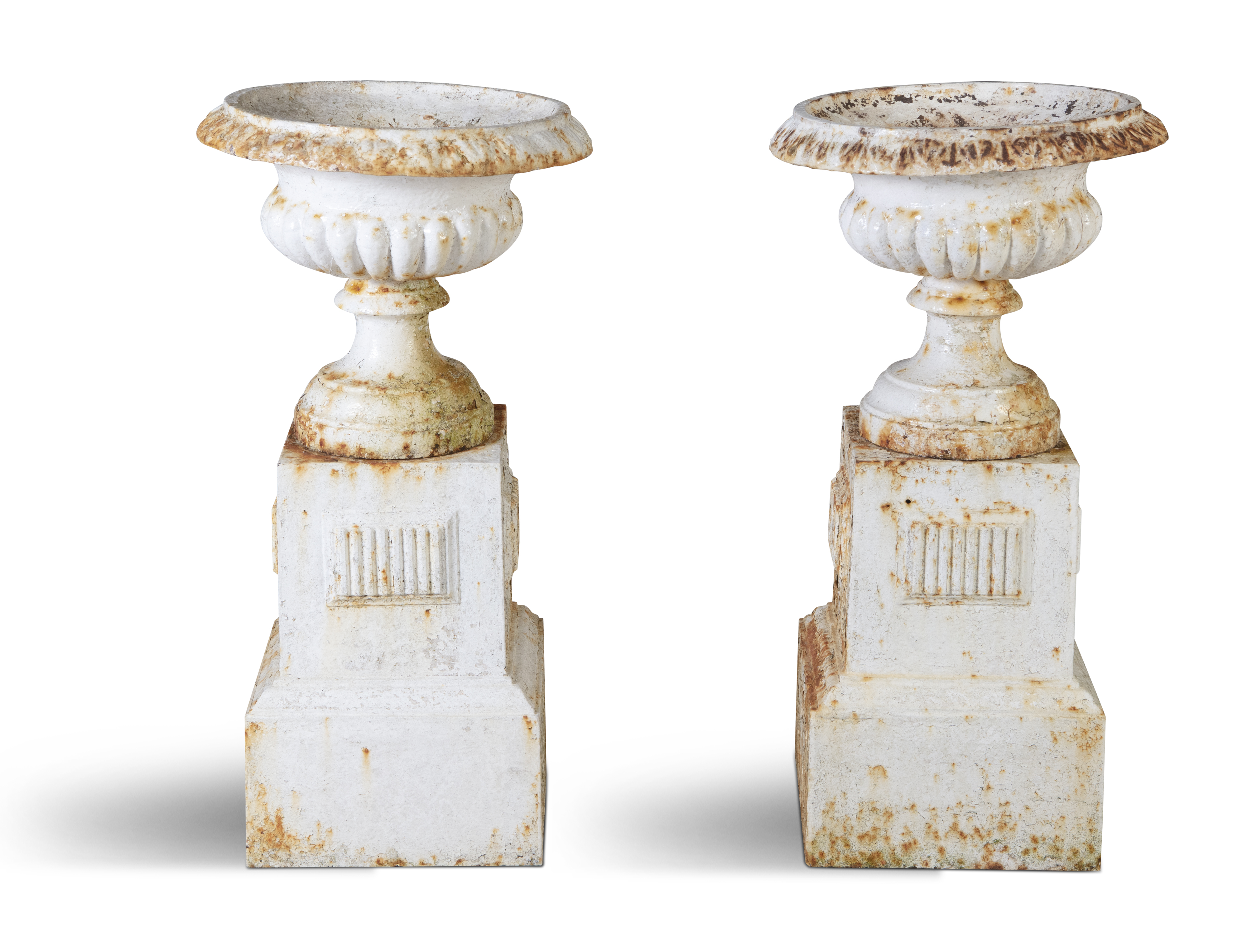 A PAIR OF VICTORIAN CAST IRON GARDEN URNS, each of classical design, with overturned rims and