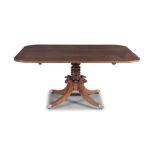 A 19TH CENTURY MAHOGANY SHAPED RECTANGULAR BREAKFAST TABLE, the plain snap-top raised on a turned