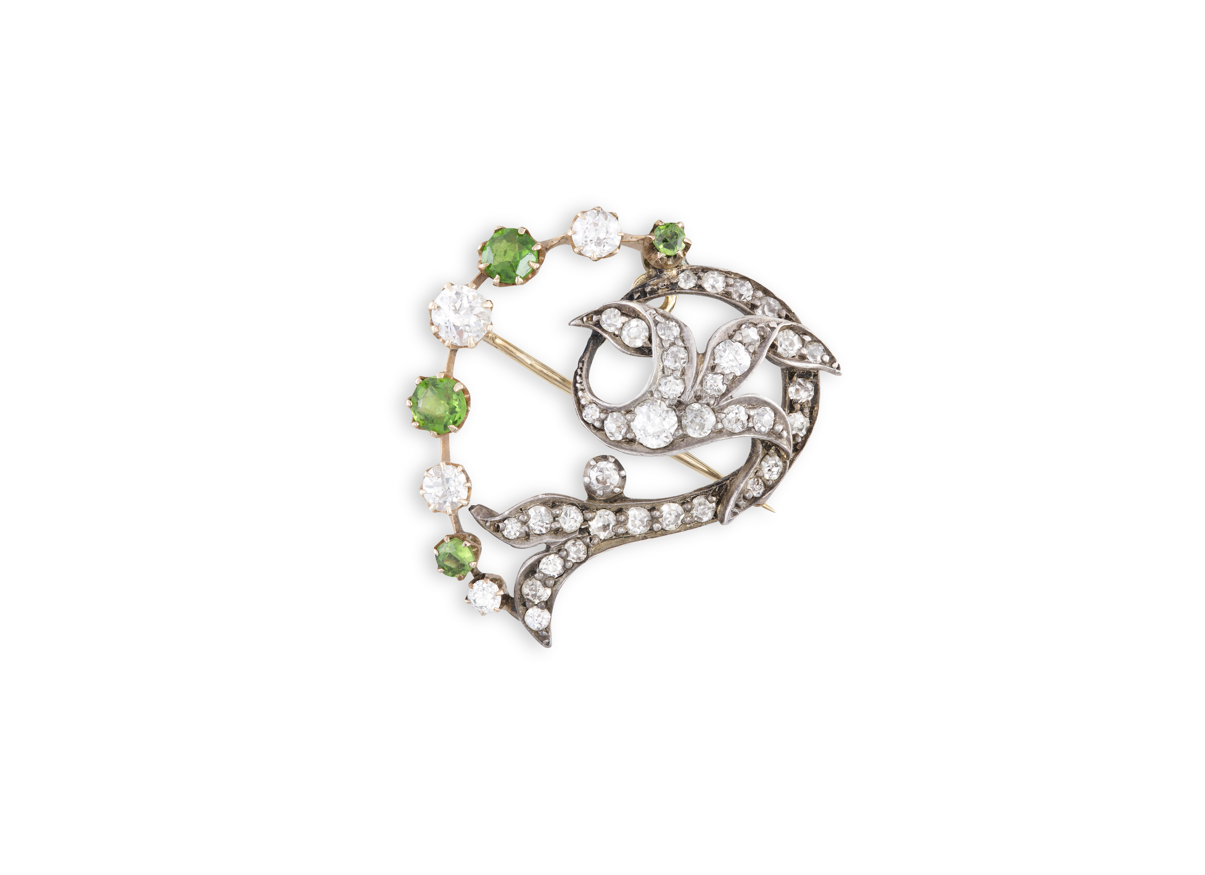 A VICTORIAN DIAMOND AND PERIDOT BROOCH, mounted in silver and gold, length 3cm