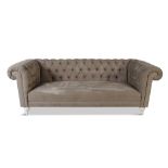 A BUTTON BACK CHESTERFIELD SOFA, of typical form, upholstered in green fabric, raised on short