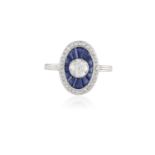 AN EARLY 20TH CENTURY SAPPHIRE AND DIAMOND TARGET RINGSet with an old brilliant-cut diamond weighing