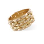 A RETRO GOLD BRACELET, CIRCA 1940The flexible bracelet set with 5 rows of bi-coloured gold faceted