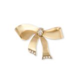 A GOLD AND DIAMOND BROOCHThe yellow gold bow, centrally set with round brilliant-cut diamonds to