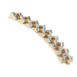 A RETRO GOLD AND BLUE TOPAZ 'ESCALIER' BRACELET, CIRCA 1945The highly articulated gold links, each