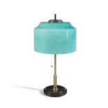 A 1960s brass table lamp, with a green glass shade, by Vistosi, Italy. 50cm high.