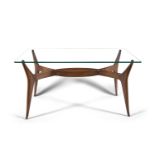 A 1950s glass topped coffee table on a walnut base, Italy. 49 x 90 x 46cm