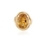 A CITRINE COCKTAIL RING, CIRCA 1960Composed of an oval-shaped citrine within a surround of