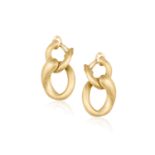 A PAIR OF GOLD PENDENT EARCLIPSEach composed of polished interlocking gold hoops, in 18K gold,