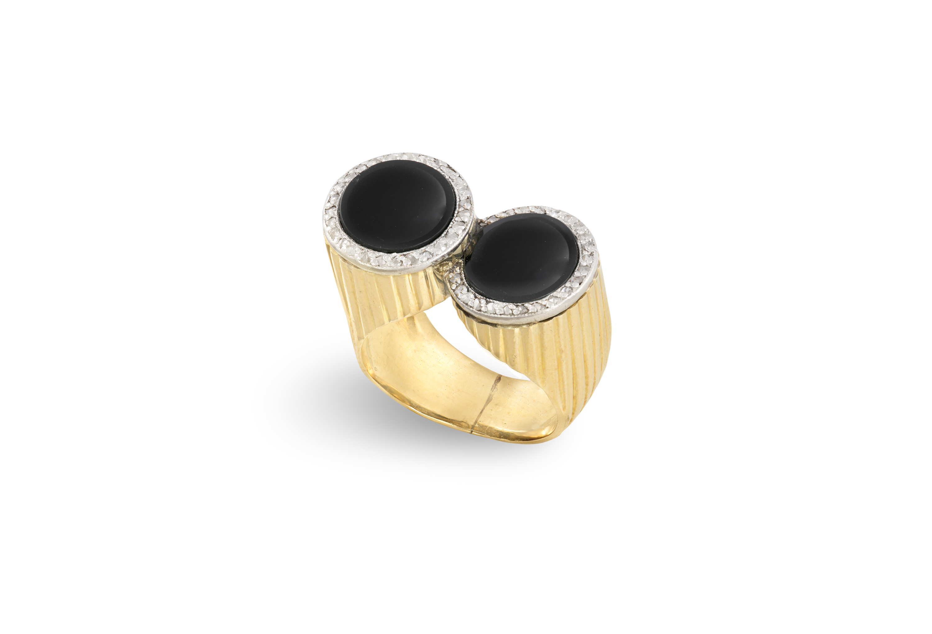 A RETRO ONYX AND DIAMOND COCKTAIL RING, CIRCA 1940Each round onyx plaque set within a surround of