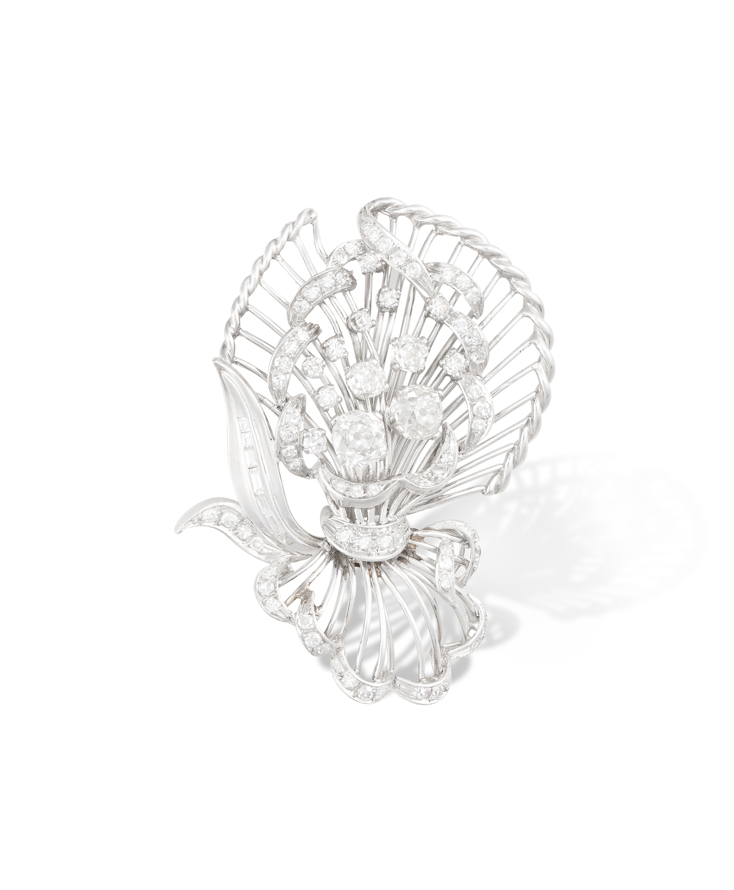 A DIAMOND SPRAY BROOCH, CIRCA 1950The stylised flower bouquet set with old cushion, single and