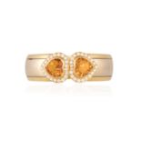A CITRINE AND DIAMOND BANGLE, BY HEMMERLEThe polished bi-coloured gold bangle with terminals