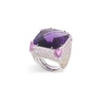 AN IMPORTANT AMETHYST AND GEM-SET COCKTAIL RINGThe large cushion mixed-cut amethyst weighing 37.
