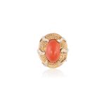 A CORAL AND DIAMOND DRESS RING, CIRCA 1960The bombé domed mount of ropetwist design, set to the