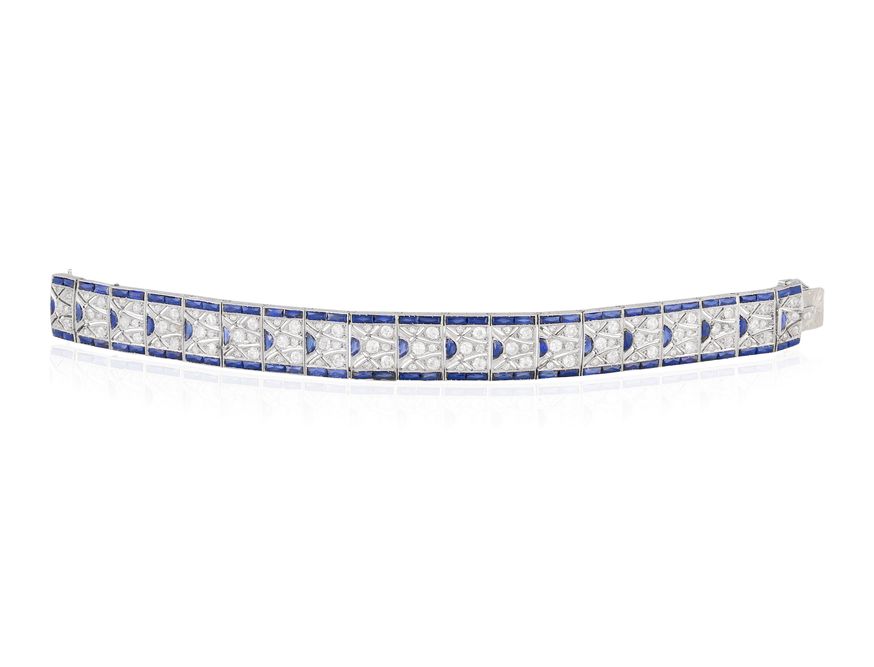 AN ART DECO DIAMOND AND SAPPHIRE BRACELET, CIRCA 1925The articulated strap of geometric design,