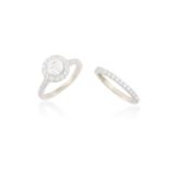 A DIAMOND SINGLE-STONE RING WITH ETERNITY RINGThe round brilliant-cut diamond weighing 0.90ct,