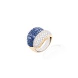 A SAPPHIRE AND DIAMOND DRESS RINGOf bombé form, pavé-set with a crossover of calibré-cut sapphires