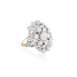 A DIAMOND DRESS RINGComposed of an openwork domed plaque set with an old brilliant-cut diamond at