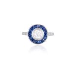 A SAPPHIRE AND DIAMOND TARGET RINGThe collet-set European-cut diamond weighing approximately 0.40ct,