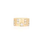 A DIAMOND RINGThe thick polished gold bang highlighted with brilliant-cut diamonds at the centre,