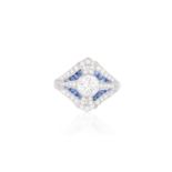 A DIAMOND AND SAPPHIRE DRESS RINGThe collet-set round brilliant-cut diamond within a frame of