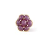 A RUBY AND DIAMOND BROOCHDesigned as a flowerhead, set with oval-shaped cabochon rubies accented