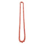 A CORAL BEAD NECKLACEDesigned as a row of graduated coral corallium rubrum beads, measuring