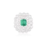 AN EARLY 20TH CENTURY EMERALD AND DIAMOND DRESS RINGThe cut-cornered rectangular-cut emerald