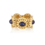 A LAPIS LAZULI AND GOLD BRACELETThe articulated bracelet designed as five oval cabochon lapis lazuli